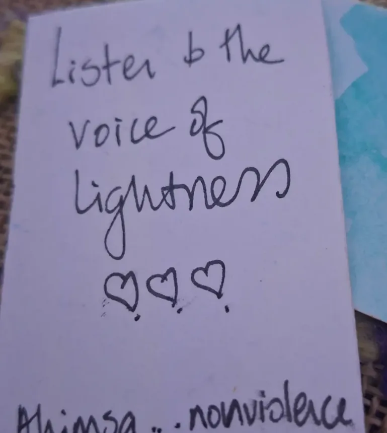 Jane’s handwritten note on a card: “Listen to the voice of lightness”, three hearts, and “Ahimsa… nonviolence” below