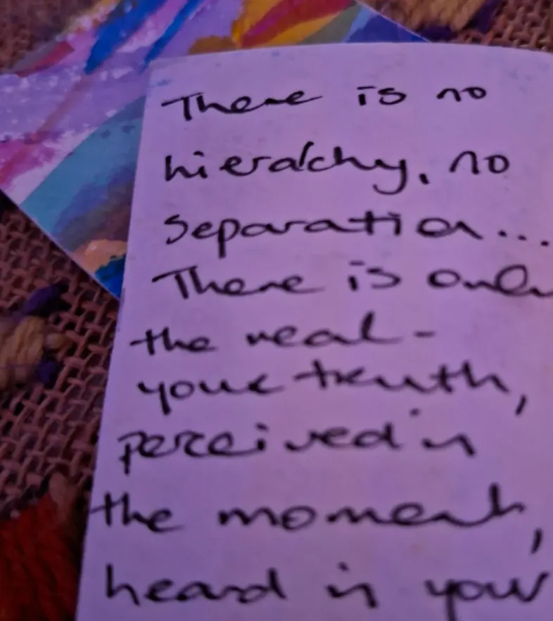 Jane’s handwritten note on a card, beginning “There is no hierarchy, no separation… There is only the real — your truth, perceived in the moment…”